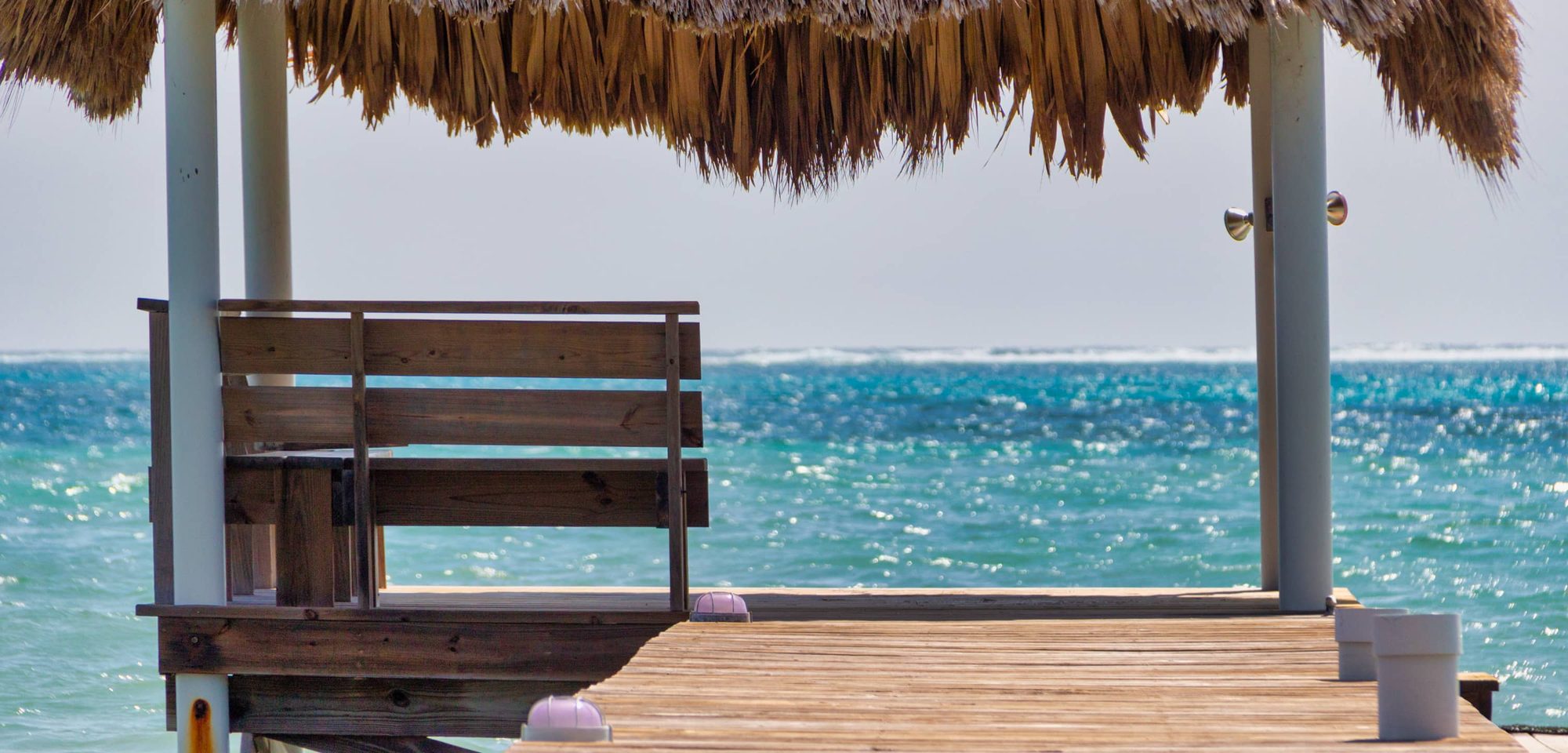 A shaded palapa at the end of the White Sands Cove dock
