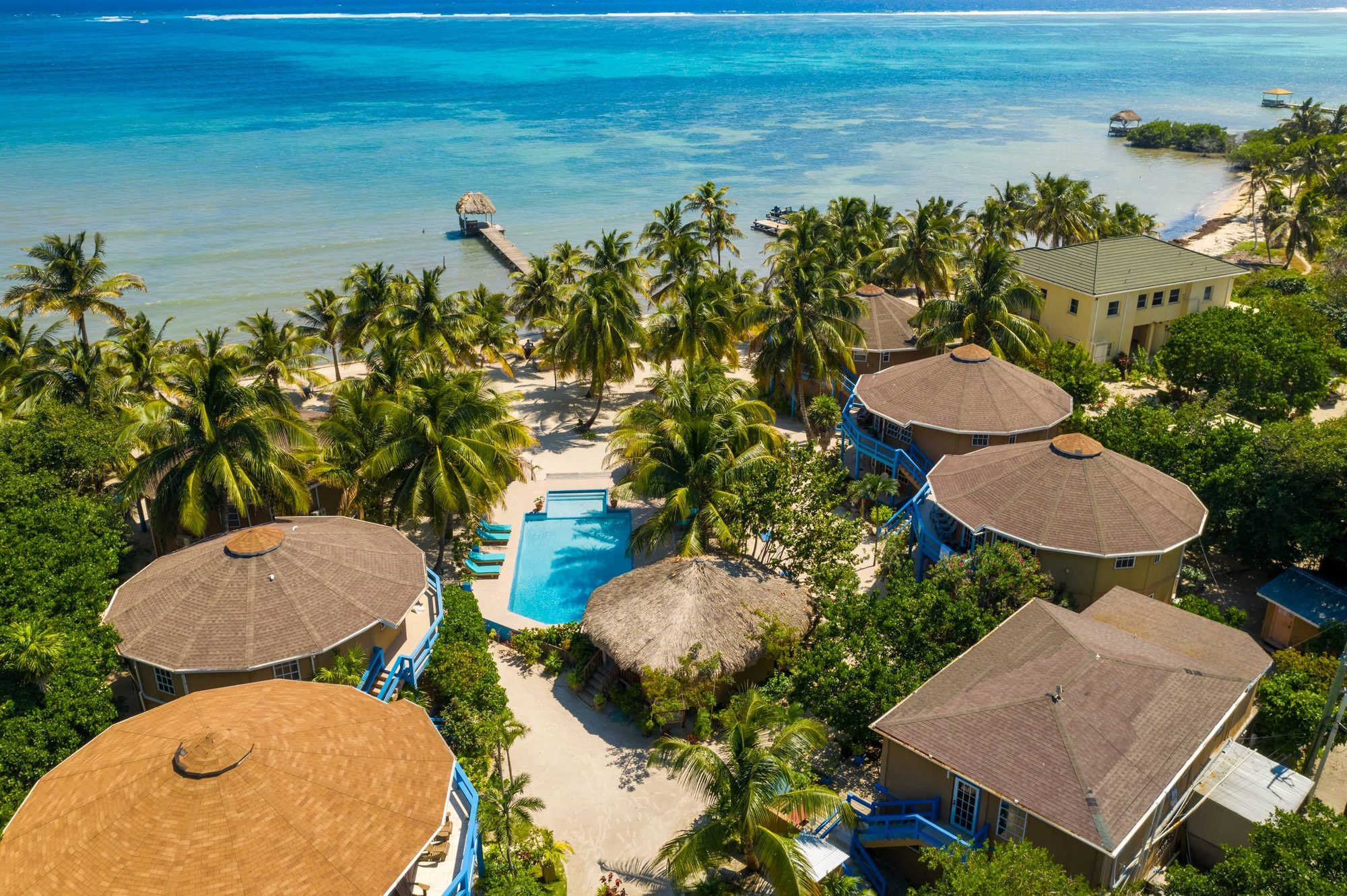Aerial view of the White Sands Cove beachfront, pool and dock